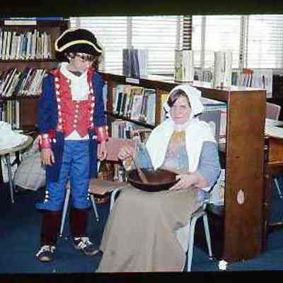Colonial girl and boy in Revolutionary uniform