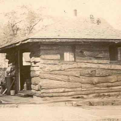 Log Cabin behind Pharmacy for storage