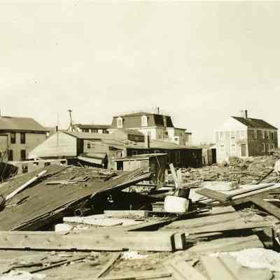 Large debris field in front of houses