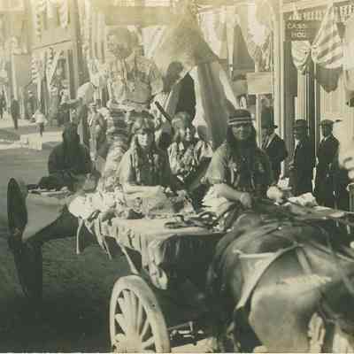 Indians and teepee on wagon