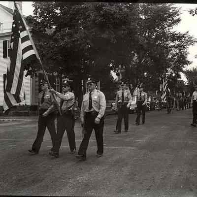 Firemen or police marching in parade
