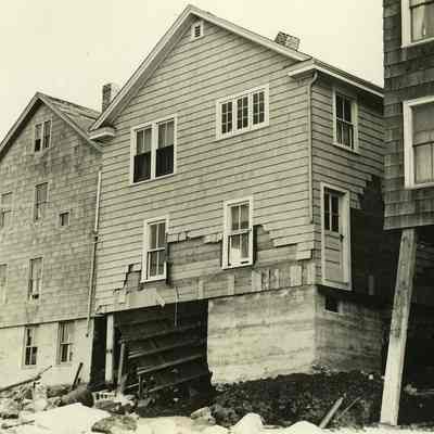 Damaged houses with missing foundations