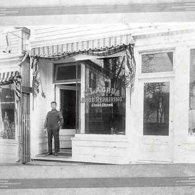 Camelo LaGrua outside his shoe repair shop