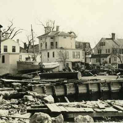 Damaged houses, fishing boats, and automobile