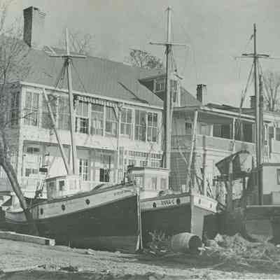Fishing boats washed ashore behind Water Street