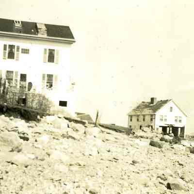 Two very heavily damaged houses