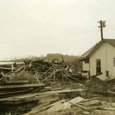 Damaged houses with debris