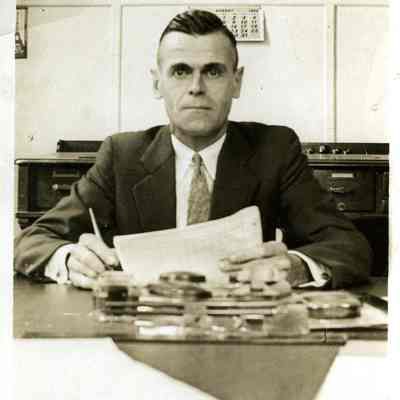Merton Clark at desk