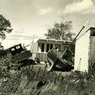 Boats washed up near buildings