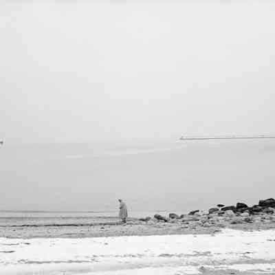 Woman on Beach in Winter