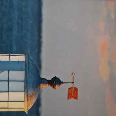 Lighthouse tower with weathervane