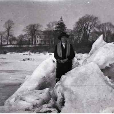 Woman on Quanaduck Cove with blocks of ice