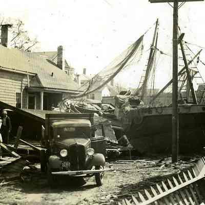 Fishing boats and damaged houses
