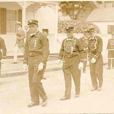 Firemen marching in Fire Parade, corner of Church and Main Streets, Stonington CT