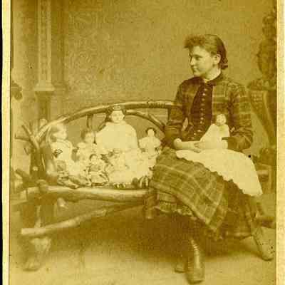 Unidentified young woman with dolls