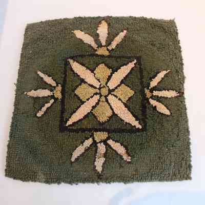Green square hooked rug