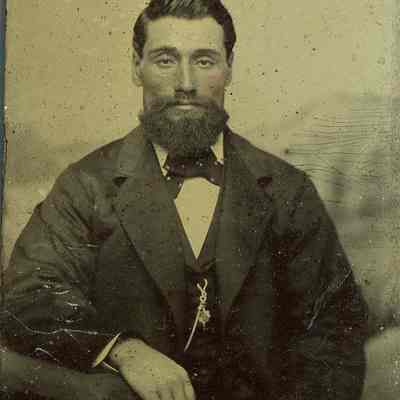Unknown bearded man seated with chain