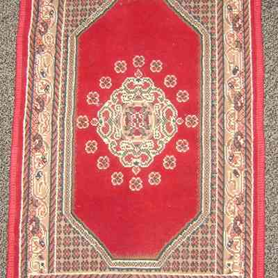Afghan sitting mat or prayer rug.