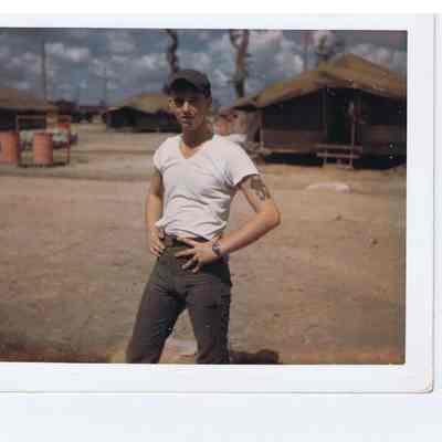 Dennis Childs standing in Vietnam