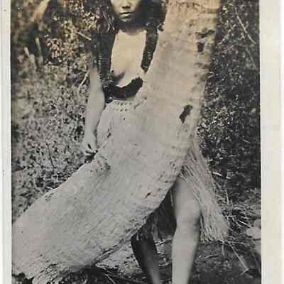 Author's Personal Collection: Hula dancer by cocoanut tree, undated photo