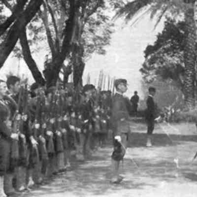 For reference only: Bluejackets of the USS Boston occupy Arlington Hotel grounds during the overthrow of Queen Liliʻuokalani, with US Navy Lt. Lucien Young in command of troops. Site of childhood home of Queen Liliʻuokalani. US Naval History and Heritage Command photo.
