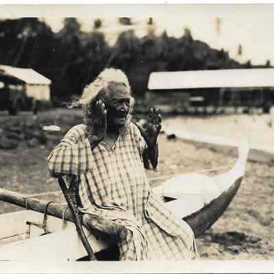 Kupunawahine sitting on outrigger canoe