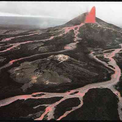 Author's Personal Collection: A vigorous lava fountain at Pu'u O'o feeds rivers of lava that crisscross the landscape of Kilauea east rift. These rivers are over 30 feet wide in places, sometimes moving at speeds of 25 mph. J.D. Griggs 1986.