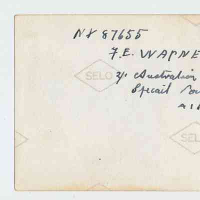 2023.9.24v: Reverse of photograph showing inscription.
