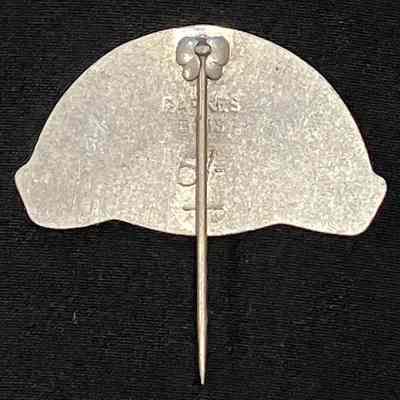 Reverse of pin, showing manufacturer and price.