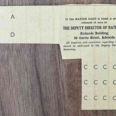 2023.252.8r: Reverse of clothing ration card, with stamps, issued in 1947.