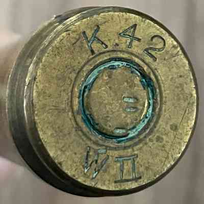 2023.220.34: Detail of the head stamp. The green ring indicates this