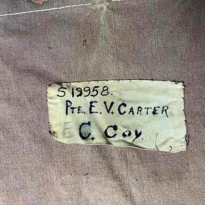 2023.1.11-crop: Identification label showing service number, rank name and battalion