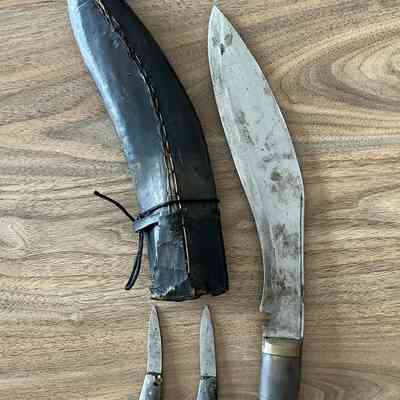 2023.59.1: Khukuri knife with scabbard, showing chakmak and karda.