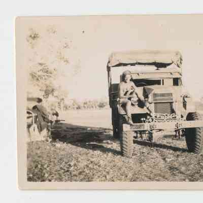 Unidentified Australian Soldier Sitting on Military Vehicle