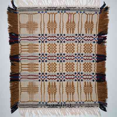 Pennsylvania geometric crib coverlet; tied half doublecloth; William Leinbach 2001