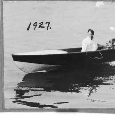 Man in vessel underway with outboard motor running
