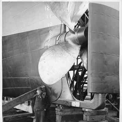 Joe O'Boyle standing next to hull