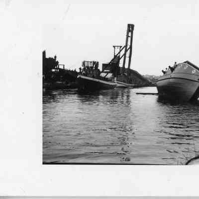 Unidentified vessel after being put in water with Betty O. in background