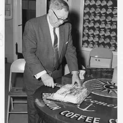 John Roen cutting birthday cake