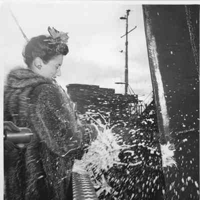 Mrs. Donald Davis christening PF-70 USS Evansville