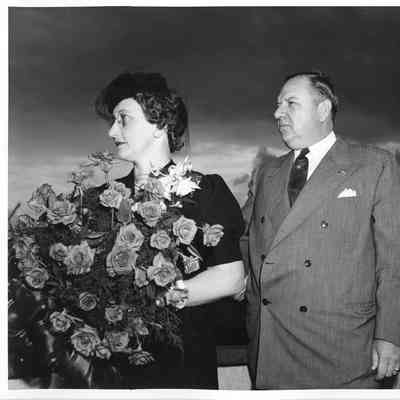 Mrs. John Butterweck holding roses