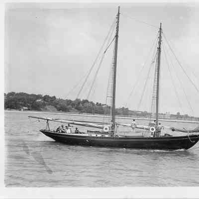 Sailboat with sails down underway