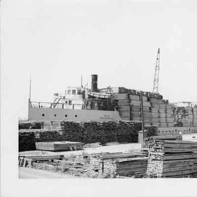 Hilda docked with a load of lumber