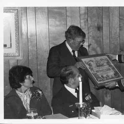 Omer Mickelson being presented Mobile Bay plank owners certificate 1979