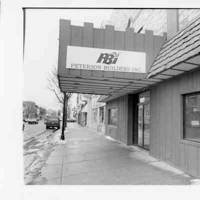 Outside of PBI with sign over doorway 1996