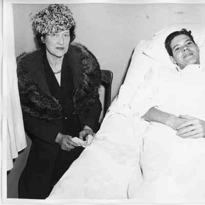 Mrs. William Gallieane sitting at bedside
