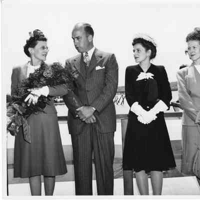 Mrs. Robert Rote Sr., Kary Reynolds, Mrs. Robert Rote Jr., and Alva Smith at christening of AK-205 USS Poinsett