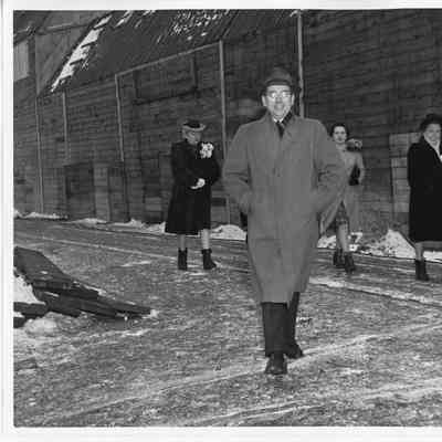 Unidentified man and three women walking