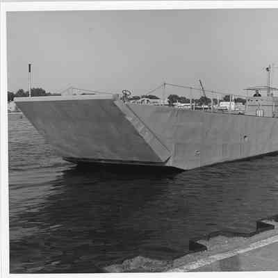 Man steering landing craft in Sturgeon Bay