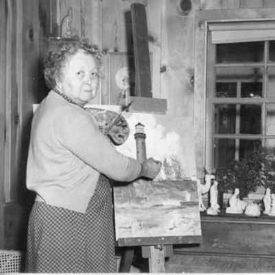 Mrs. George Martin painting lighthouse